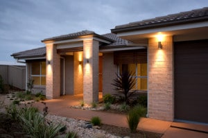 A new home with attractive outdoor lighting.